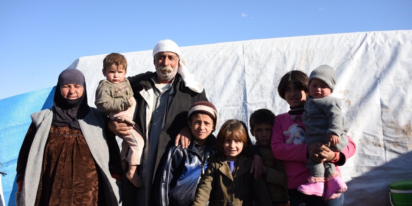Following their father’s death and their mother’s remarriage, the grandparents are looking after their eight grandchildren.  They fled the violence in ISIS-controlled Deir Az Zour and arrived in a camp in Hasakeh  on November 23. 
“I will be proud of them whatever they do. I want to be able to support them in whatever they choose”. Said the grandfather. 
The grandmother wishes to go back home when it is safe. But “our house is destroyed” she said and the trip here will be too expensive.

Photo: NRC