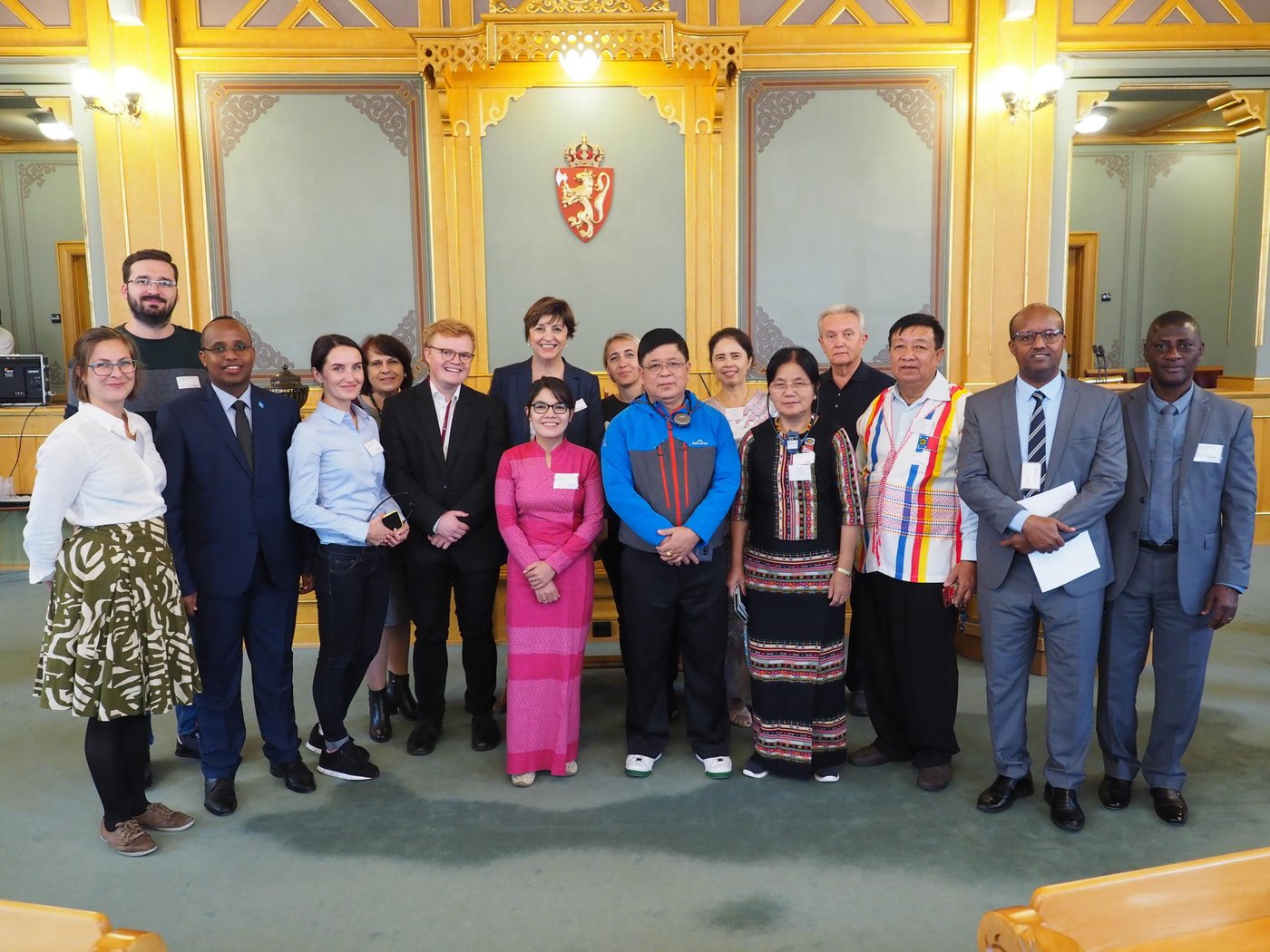 All delegates standing inside the Norwegian Parliament building.