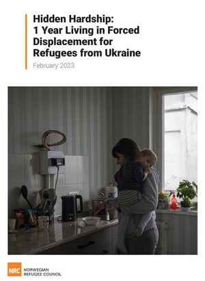 Front page of the report "Hidden hardship: 1 year living in forced displacement for refugees from Ukraine". A mother is making food in a kitchen, carrying her small child on her arm.