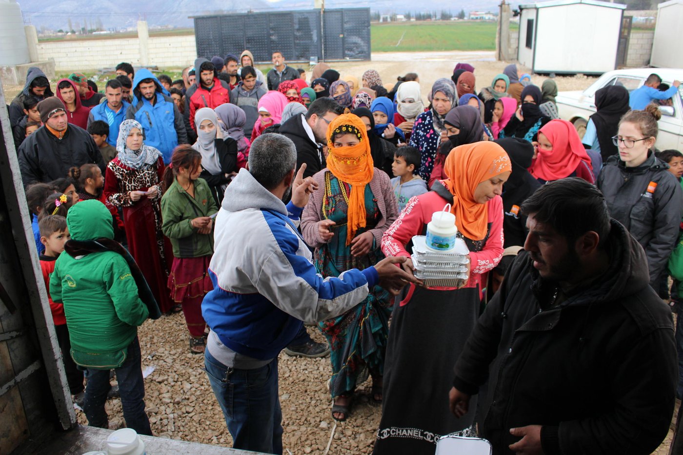 This winter proved to be one of the toughest for thousands of displaced Syrians in Lebanon. Storm "Norma" and “Miriam” caused damages to infrastructure, roads and homes across the country, putting at least 70,000 refugees at risk. Many had to evacuate to alternative locations as their tents collapsed because of the flooding.
Thanks to the generosity of our private sponsors, the Norwegian Refugee Council (NRC) was able to provide funding to a local Lebanese organisation, Union of Relief and Development Associations (URDA), that set up a kitchen in a refugee settlement in the Bekaa Valley in eastern Lebanon. URDA employs refugees to cook the food and distribute the meals to thousands of refugees living in tented settlements.
In March 2019, NRC supported the preparation of over 1,500 meals for 300 refugee families, the majority of whom were evacuated from their homes after the winter storms. Some of them have still not been able to return to their homes as their tents are being rehabilitated.
Credit: Racha El Daoi/NRC
