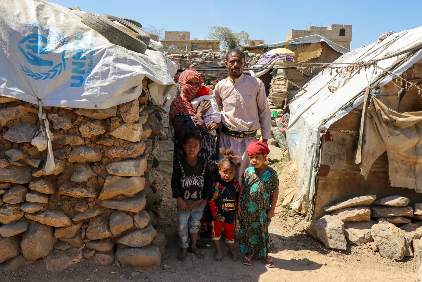 Mohammed and his family in front of the home they built by hand over many months, after fleeing to Amran.
Photo: Mohammed Hasan/NRC