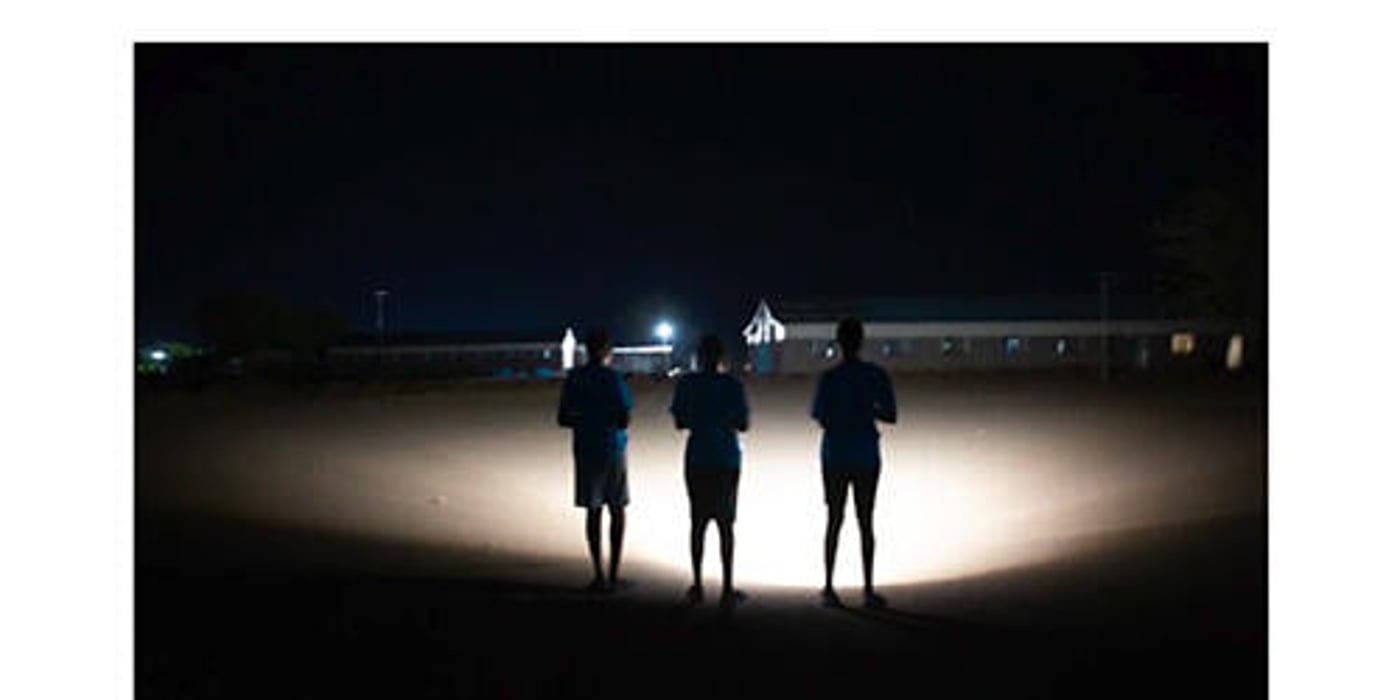 Front page of the white paper "Lighting the Path: Innovative Finance for a Just and Inclusive Transition to Clean Energy in Humanitarian Settings". 