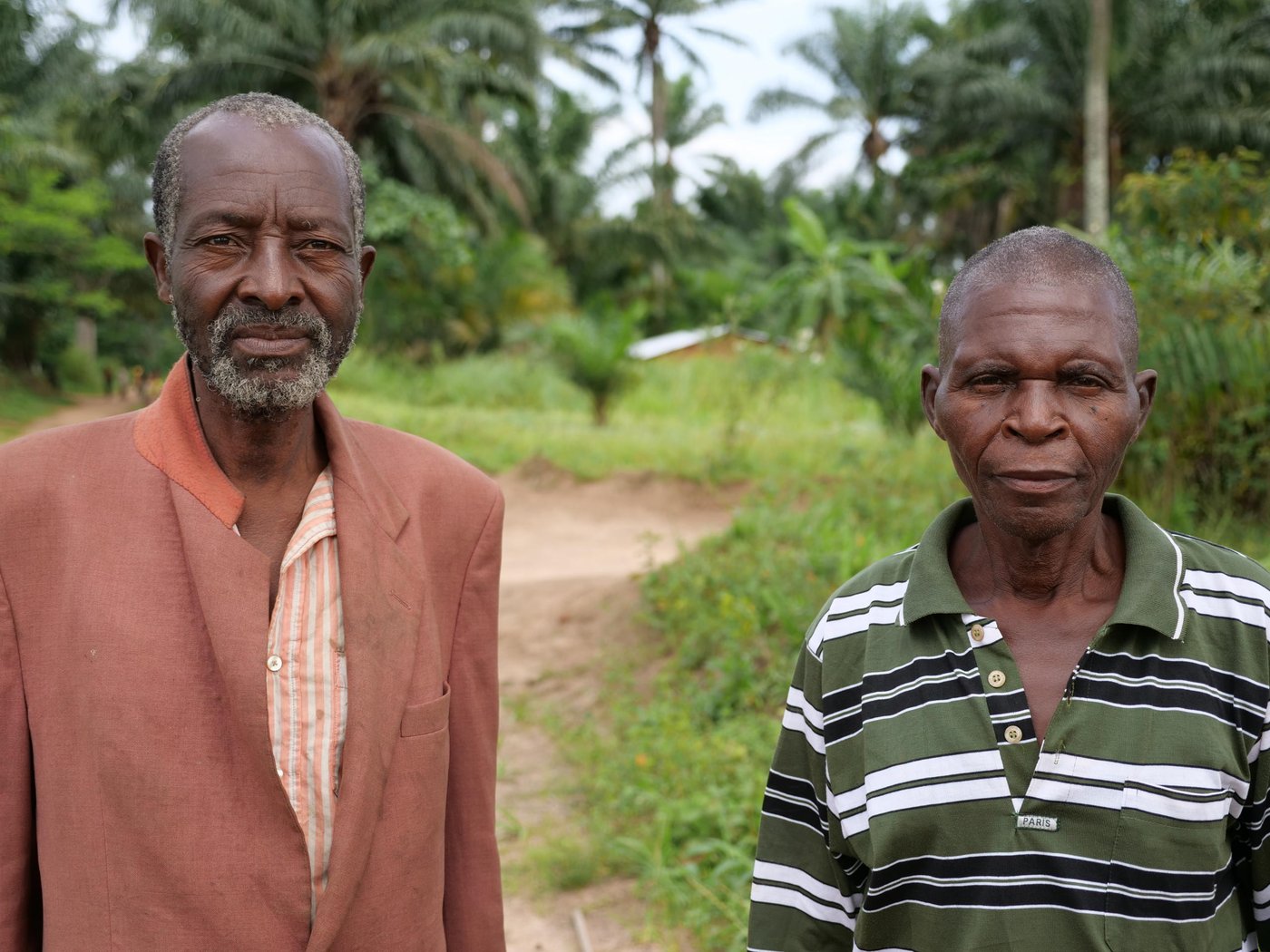 Alphonse Kabasele Bushila poses next to Emile Ndibu, the village chief of Tshiambula. These two village chiefs were in conflict with one another but NRC's efforts at mediation led to these two villages to now be at peace.
Photo: Itunu Kuku/NRC