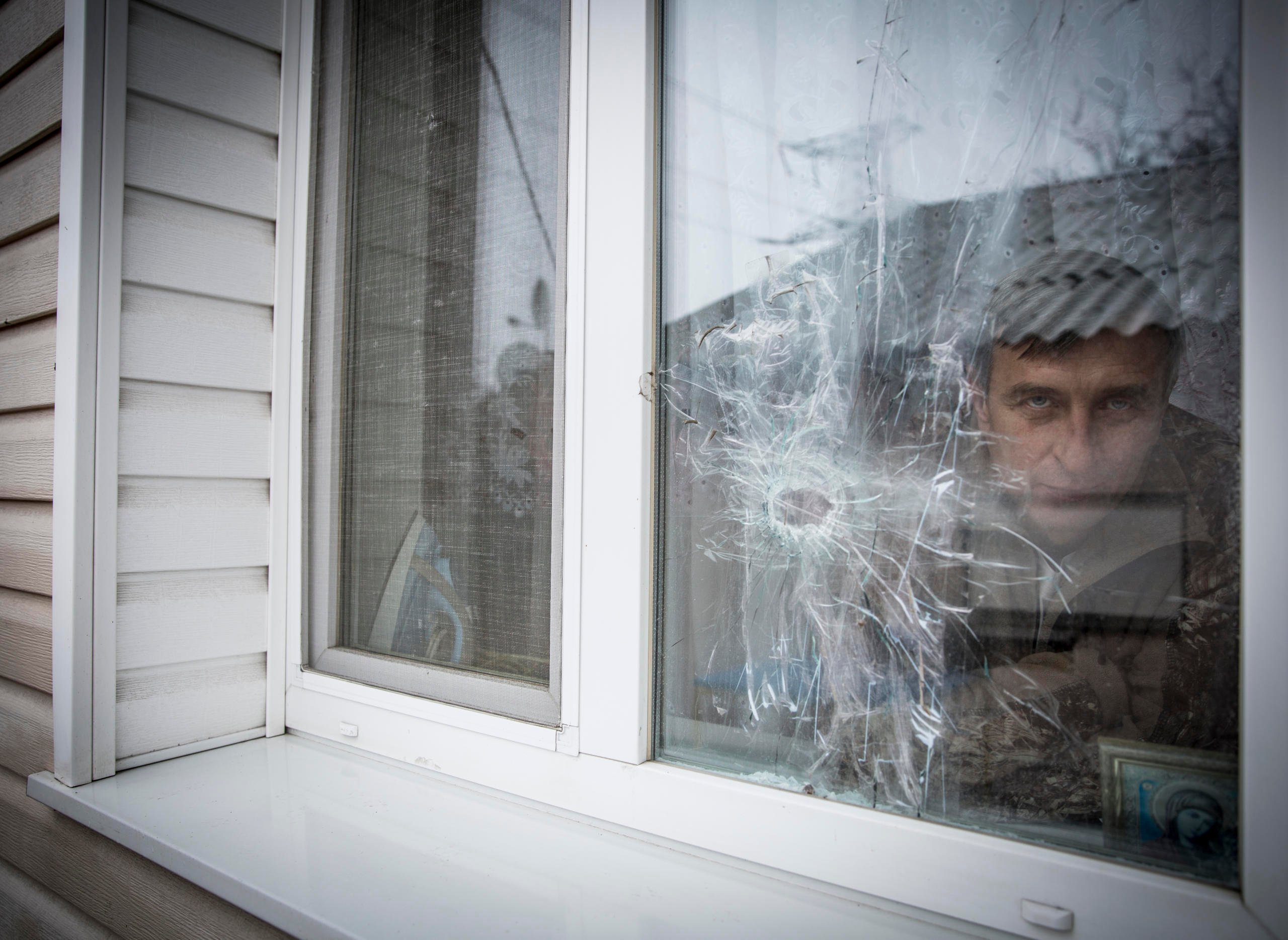 “I missed my home”. Yurii Polieshko returned to his village by the contact line after some time in Russia despite damages to his house, loss of income and frequent shelling.
Liudmyla, 51 and Yurii Poleshko, 55, lives in the frontline village Zaitseve in Donetsk region. For the last three years they have been unable to find jobs and survive only owing to humanitarian assistance and relatives’ support.
“We used to have levelled life. We did our own business. My wife owned a hairdressing salon, I was the owner of ventilation system control enterprise in nearby Horlivka (currently non-government controlled area). We were providing our services in several regions – from Luhansk to Zaporizhzhia in eastern Ukraine. However, the conflict, which came to our country in 2014, turned our life upside down. Initially, when the hostilities started, we tried to continue our work, but when the crossing point was set up in our village, we were urged to shut down all our business, because of limited access to that area. It was in August 2014. ”, - says Yurii Poleshko.
Since the conflict outbreak, Zaitseve has become one of the hot spots of crossfire between conflicting parties. One part of the village is under Ukrainian Government control, another under de-facto authorities. Despite the ceasefire agreement, the hostilities are still ongoing., Usually the shelling starts there, when it gets dark, sometimes the incidents happen in the daytime. At the streets you can hardly find its residents, people try not to come out unless it is absolutely necessary. Most of the windows in the houses are closed with plywood, firewood and shields. People use all possible means to protect themselves. Many residents left the settlement, mostly the elderly people remained.
“We felt abandoned. For a while it was no man’s land. In 2014 it was even difficult to bury someone in the settlement, because administratively the settlement was subordinating to non-government-controlled Horlivka”, recalls Yurii.
“Initially we left the settlement in December 2014 after very heavy shelling, the whole night we were sitting in the basement. It was too stressful for us. For 8 months we were staying with relatives and friends. Our friend even proposed to buy a house for us in Russia, but we refused, because there is nothing like home”, - says Yurii.
“We cannot explain why we returned. We are probably too attached to the house. How could we leave all this? Yes, it is scary to hide in the basement. But when you come out from it you are home”, says Liudmyla.
In 2016 Poleshko’s house was damaged by shrapnels. They could enter the house only through the window, because the door was curved by the explosion and could not open. The family repaired the house. However, when you enter the house, you can still see the shelling traces; holes in the windows, ceilings and walls.
“I have nine years to wait before I can receive my pension. For three years we haven’t had any income. Now we are fully dependent on humanitarian assistance and our relatives”, - says Liudmyla.
Recently, the Poleshko family started receiving cash for foodstuff from NRC. Thus, the family will be secure with food for five months during the cold season.
“It is better to receive cash than to get in-kind assistance, because sometimes what you need is to buy the gas bottle before you can cook the food. Some people are on diet due to health issues, so they can buy food according to their own needs. For us such assistance is crucial. We are not pensioners yet. But we are vulnerable, because we cannot find the way to earn money. Psychologically it is difficult to depend on humanitarian assistance, as we used to be self-sufficient in the past”, - says Yurii.
Photo: Ingebjørg Kårstad/Norwegian Refugee Council